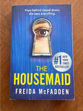 The Housemaid by Freida McFadden - Blue & Yellow Paperback Thriller